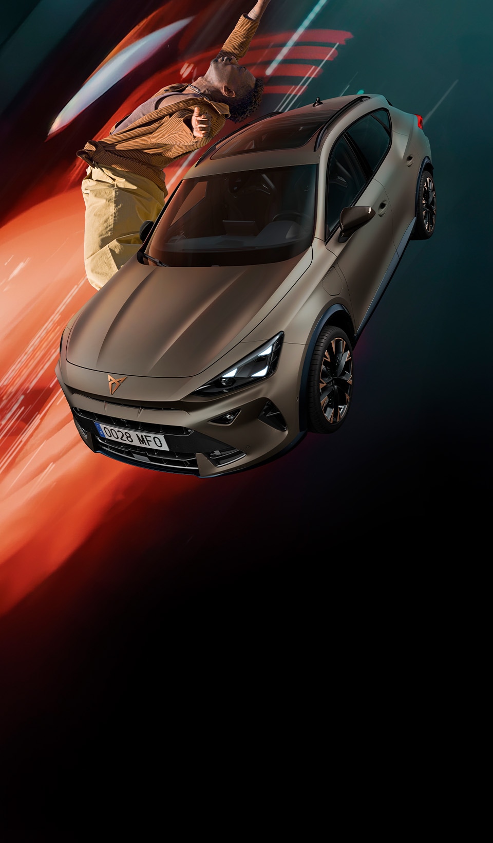 A CUPRA Formentor CUV suspended diagonally, next to a rocky, cliff-like structure. A charging cable is connected to the car from a charging unit on the cliff face. A CUPRA Formentor CUV suspended diagonally, next to a rocky, cliff-like structure. A charging cable is connected to the car from a charging unit on the cliff face.